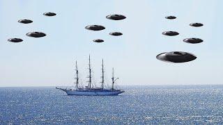 13 UFOs surround a Ship in the ocean and make it go in a specific direction