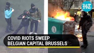 Watch: Brussels on edge as thousands clash with police over new covid rules amid infection surge